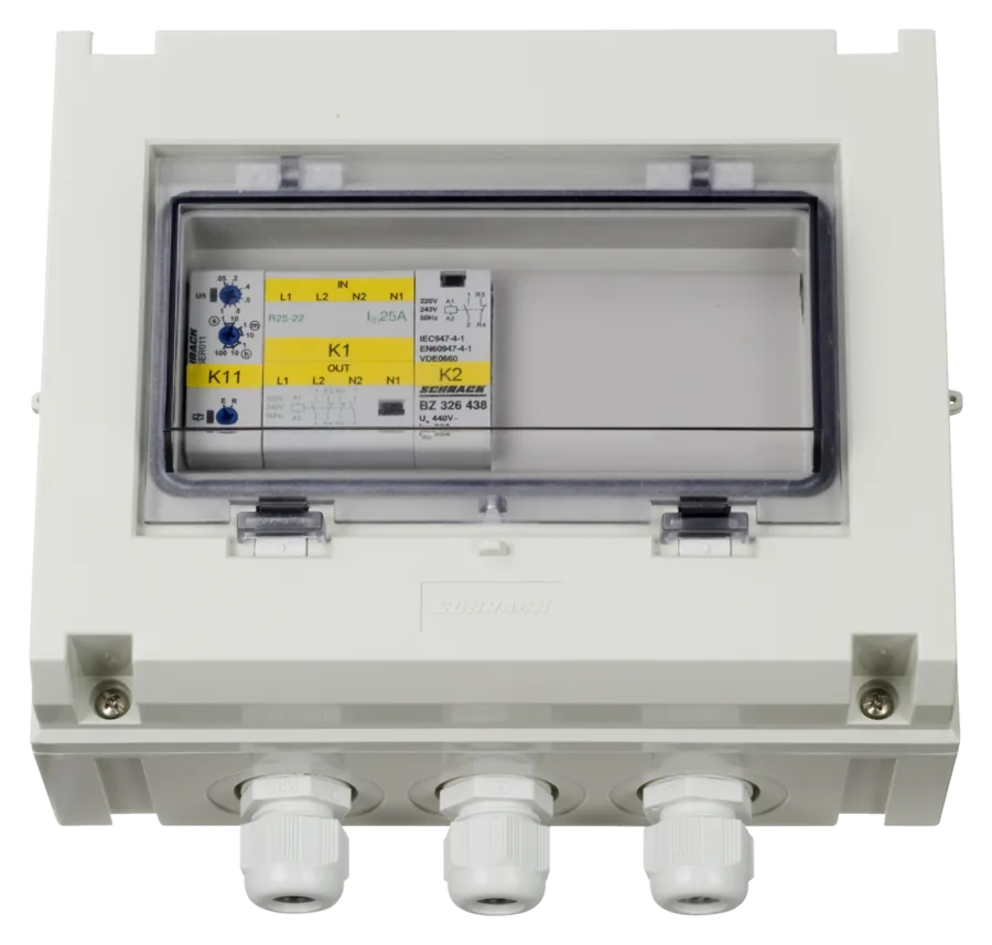 VE Transfer Switch 5 kVA from the front — through the window you can see timer relay K11, contactor K1 marked R25-22 (25 A) and contactor K2; three glands underneath